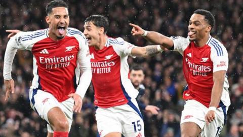 William Saliba celebrates scoring for Arsenal against Manchester United.