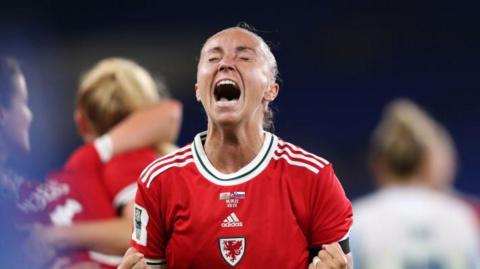 Natasha Harding celebrates a goal during a Wales match