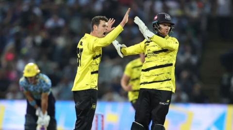 Ollie Price (left) celebrates the wicket of Jacob Bethell