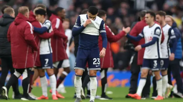 Tottenham Hotspur players trudge off the field after losing to Newcastle United in the Premier League