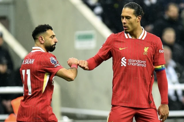 Liverpool's Mohamed Salah celebrates with Virgil van Dijk