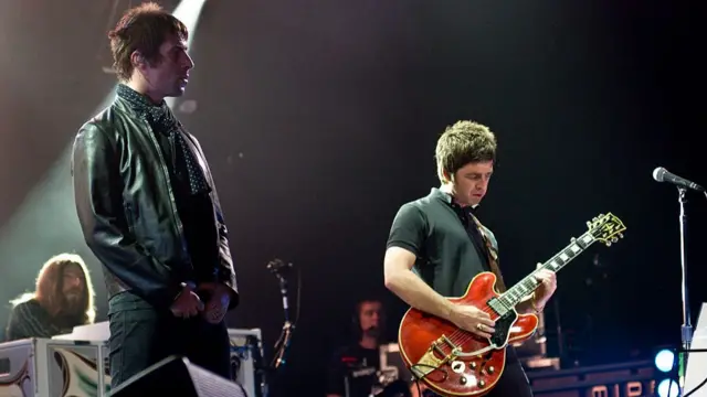 Liam Gallagher (L) and Noel Gallagher of English rock band Oasis, live on stage at the Wembley Arena, October 16, 2008.