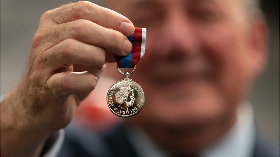 Phil McDermott with a medal