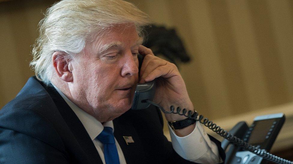 Donald Trump uses a telephone to call Putin on 28 January, 2017