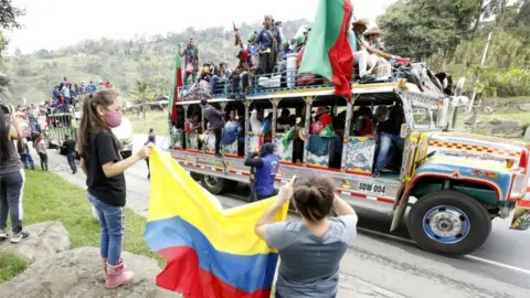 EPA Indigenous people from Cauca region arrive in a buses caravan with the intention of speaking with Colombian President, Ivan Duque, in Soacha, Colombia, 18 October 2020