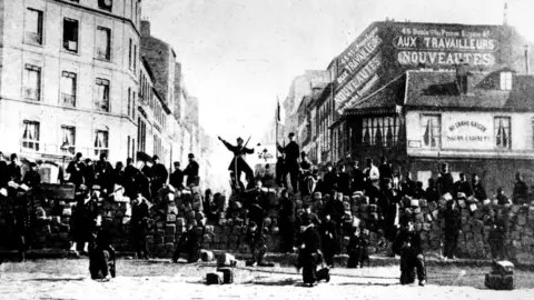 Getty Images 1871 Roadblock at the corner of Menilmontant street and Prince Eugene avenue (nowadays Voltaire avenue), 1871, France