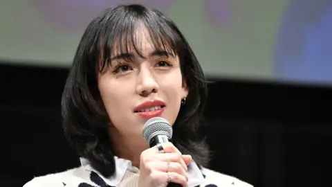 Getty Images Ryuchell speaks into microphone at Human Rights Festa Tokyo 2022 talk event on November 20, 2022 in Tokyo, Japan