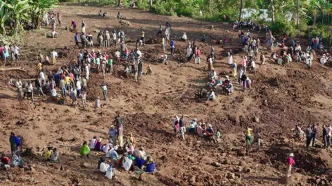 BBC/Amensisa Ifa People gathered at the site of the landslides in Gofa zone, Ethiopia - 24 July 2024