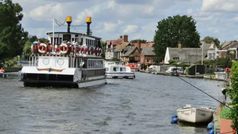 Three boats on the river at Horning.