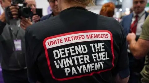 Getty Images Sharon Graham, General Secretary of Unite the Union leads a small protest in the exhibition hall against the cuts to winter fuel payments during the Labour Party Conference 2024.