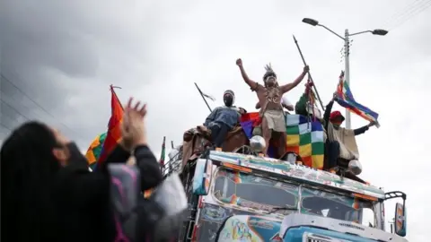 Reuters Colombian indigenous people travel on a bus to participate in a protest to ask the Colombian government for security in their territories and to stop massacres and murders of social leaders, during an indigenous meeting called "Minga" in Cundinamarca, Colombia October 18, 2020