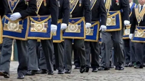 PA Freemasons march in a procession