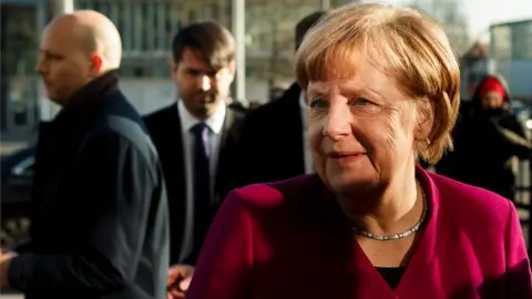 Getty Images German Chancellor and leader of the Christian Democratic Union (CDU) Angela Merkel speaks to the media about the coalition negotiations, 6 February 2018