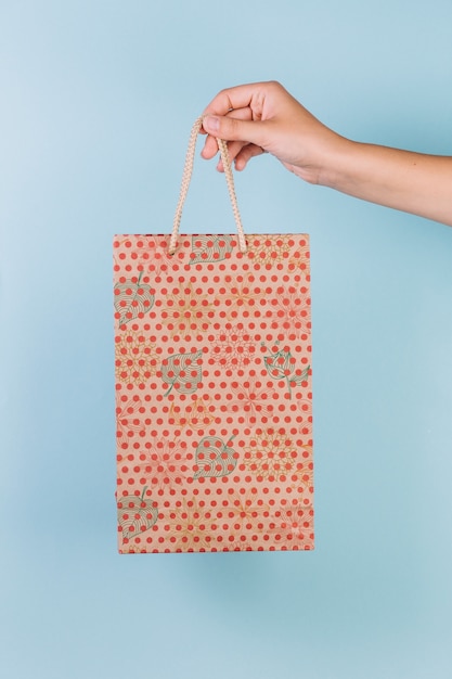 Download Hand holding shopping bag mockup | Free PSD File