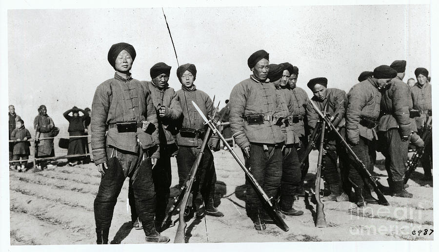 Young Male Chinese Soldiers Standing by Bettmann