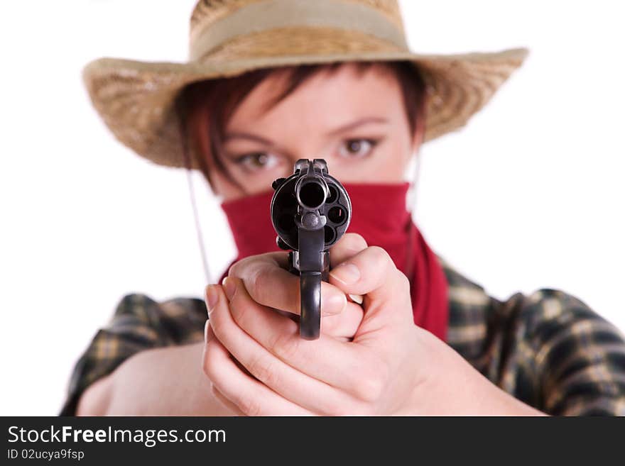 Super rodeo cowgirl in torn jeans, boots and cowboyhat. Portrait of Cowboy Holding Gun Up.