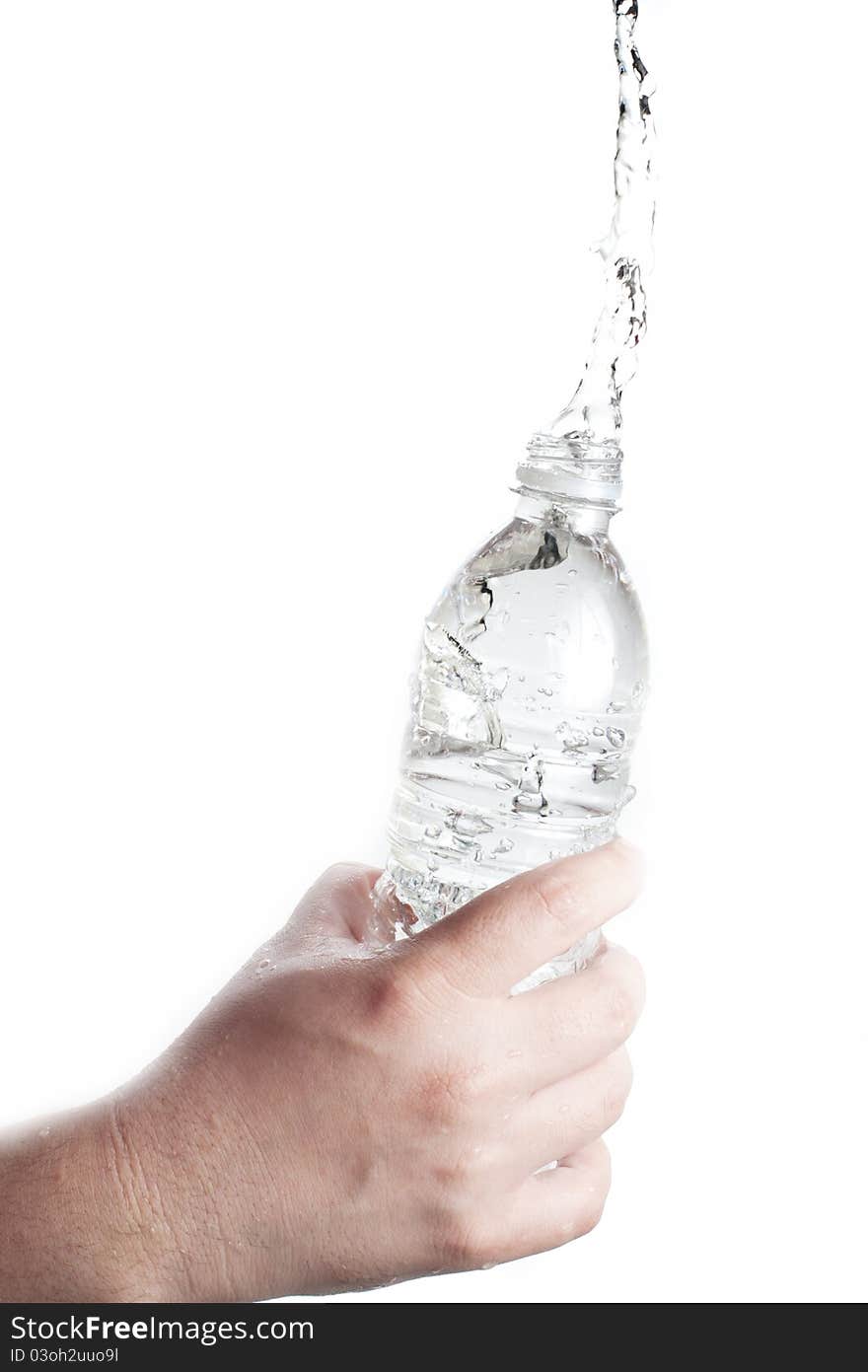 Human hand holding a bottle of water with water splash. Human hand holding a bottle of water with water splash