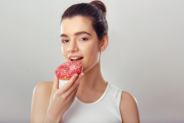 Premium Photo | Brunette woman eating tasty dessert. diet. brunette ...