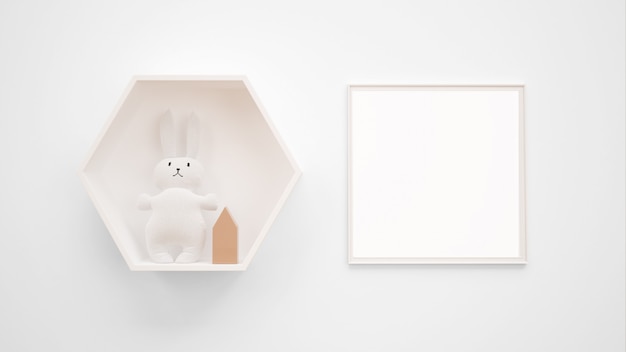 Maquete de moldura em branco pendurado na parede ao lado de um brinquedo de coelho