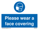 Please wear a face covering Text: 