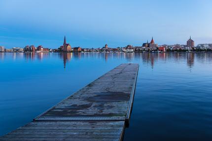 Städtereisen in Deutschland: View over the river Warnow to the city Rostock, Germany