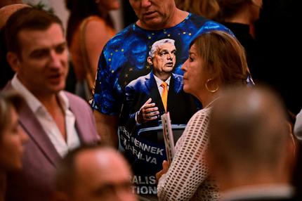 "Make Europe Great Again": A man wears a T-shirt with an image of Hungarian Prime Minister Viktor Orban as he waits for the prime minister to speak after the announcement of the partial results of the European Parliament and municipal elections, in Budapest, Hungary, June 9, 2024.