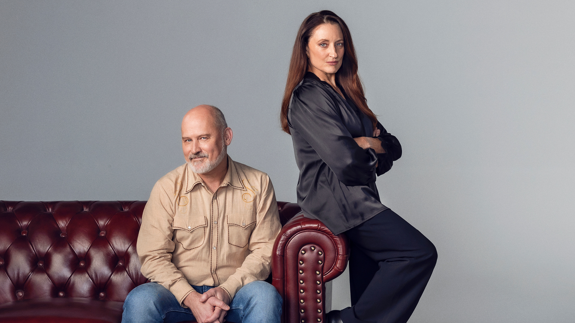 Two people sitting on couch