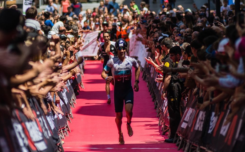 Athletes running towards the finish line at IRONMAN Vitoria-Gasteiz