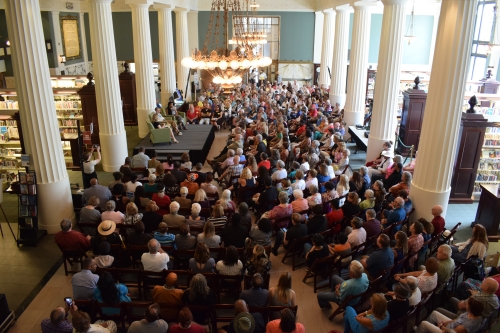 Large crowd in the main hall of a public library