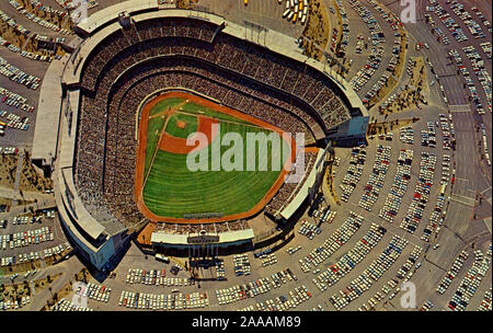 Aerial view of Dodger Stadium in 1960's era postcard. Dodger Stadium opened in 1962 for the Los Angeles Dodgers Major League Baseball season. The Dodgers had relocated to L.A. from Brooklyn in 1958 and played their first few seasons at the Memorial Coliseum before construction was complete. Stock Photo