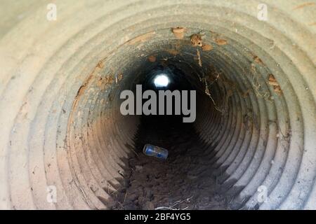 Inside view of Small culvert under a farm to market road in Texas Stock Photo