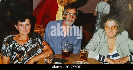 Mary Martin (left) and her partner Ted and mary's Mother June on Holiday in 1994. Mary now a grandmother who has lived in Britain for 54 years has been told by the Home Office that she will be deported because she is considered to be an American. Mary Martin, *..from Trimley St Mary, in Suffolk, was born in the United States and came to live in the UK with her British-born mother in 1949. Miss Martin, 55, has lived in this country ever since, and has never left to go abroad. Last Friday she received a letter from the Home Office telling her to leave the country within 10 days because she co Stock Photo