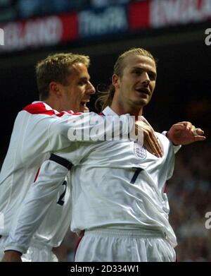 England's captain David Beckham celebrates scoring the equaliser from a free kick against Greece in the dying seconds of the FIFA World Cup European Qualifying Group Nine match at Old Trafford, Manchester. England drew 2-2 with Greece and qualified for the World Cup. eg Stock Photo