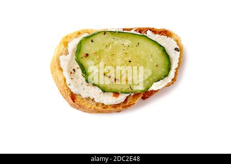 Bruschetta with cream cheese and cucumber on white Stock Photo