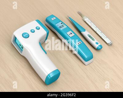 Four different types of medical thermometers on wood table Stock Photo