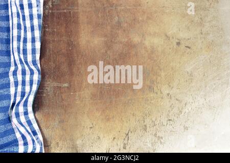 Blue checkered tablecloth on grunge background Stock Photo