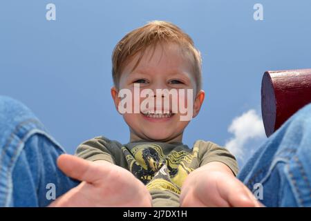 Portrait of a child on a colored blue background. Stock Photo