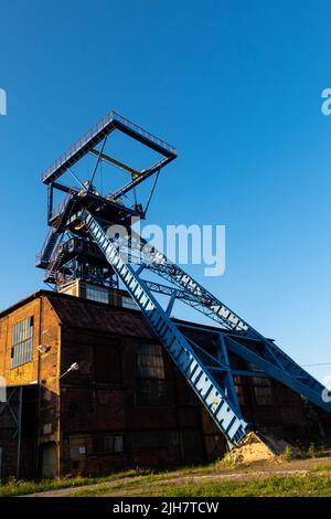 The shaft tower of a closed black coal mine. Decarbonization processes in the modern world during the energy crisis Stock Photo