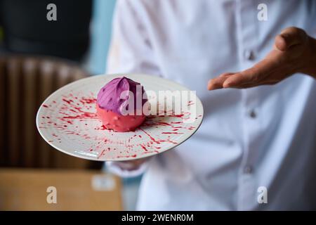 Pastry chef presents an original fruit dessert Stock Photo