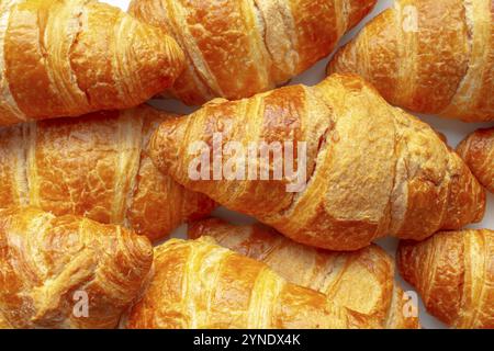 Several Croissants, crescent shape and, like other viennoiserie, are made of a layered yeast-leavened dough Stock Photo