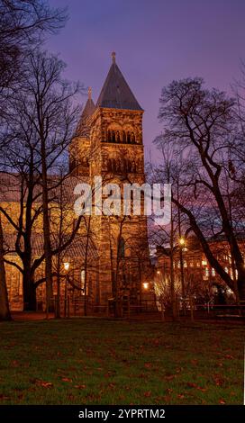 Towers of Lund Cathedral at night with an illuminated sky in red, Lund, Sweden, November 30, 2024 Stock Photo