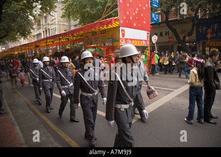 Flower festival in Guangzhou. Security guards are marching. Stock Photo