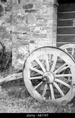 Old wooden Italian Farm used Antique Cart Wheel, San Quirico d' Orcia Tuscany Italy, Europe, EU Stock Photo