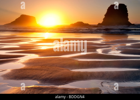 Sunset with low tide reflecting pools.Samuel H. Boardman State Scenic Corridor. Oregon Stock Photo