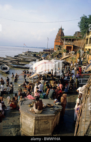 People performing ablutions in the river Ganges, Varanasi, India. Stock Photo