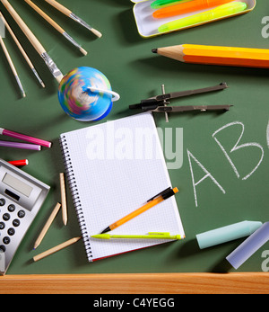 back to school concept with ABC written in school in green color blackboard Stock Photo