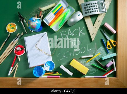 Back to school written in green blackboard education concept still life Stock Photo