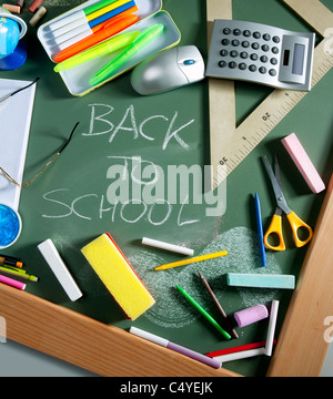 Back to school written in green blackboard education concept still life Stock Photo