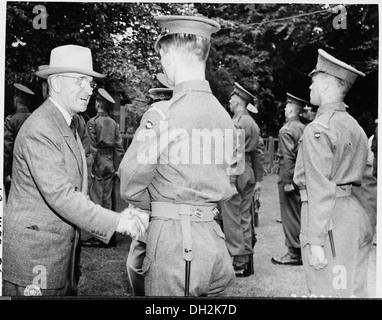 President Harry S. Truman shakes hands with Guardsman Campbell of the Second Battalian, Scot's Guard of Honor, while... 198805 Stock Photo