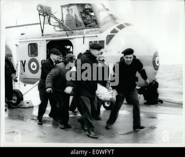 Sep. 09, 1962 - Woman survivor on board carrier: Photo Shows Mrs. Richard Elander, wife of the US Army major, is carried on a stretcher from a helicopter on board the Canadian aircraft carrier Bonaventrue after being transferred from the Swiss ship Celerina. She was one of the 48 survivors from the ditching of the Super Constellation in mid Atlantic. Stock Photo